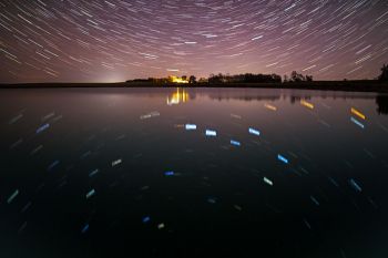 Star trails mirrored on the water on a still night near Hartford.