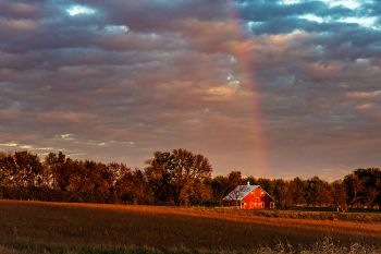 October rainbow over a red barn in rural Minnehaha County.