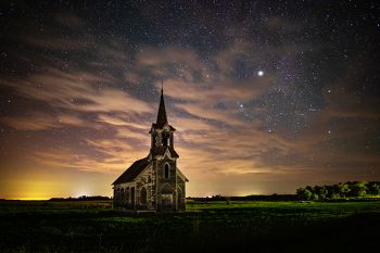 Stars with clouds and faint aurora in rural Roberts County in color.