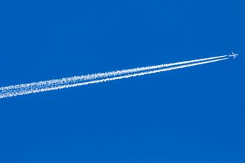 A jet with contrails above Good Earth State Park in color.