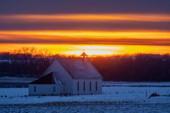 Sunset over St. Ann’s Catholic near Lake Badus in Lake County.