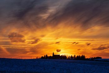 Sunset clouds with Benton Lutheran just east of Crooks.