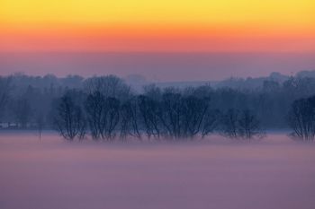 Evening fog rising in the Big Sioux River valley.