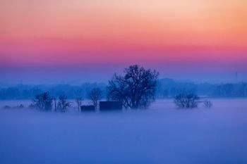 Evening fog rising in the Big Sioux River valley.