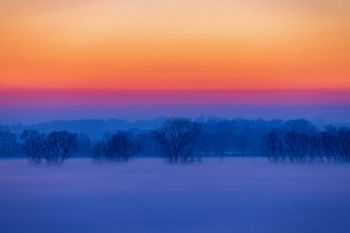 Evening fog rising in the Big Sioux River valley.