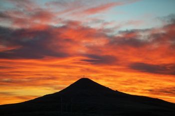 Rabbit Butte in rural Perkins County silhouetted at sunset.