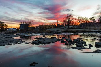 Sunrise over upper Falls Park in Sioux Falls.