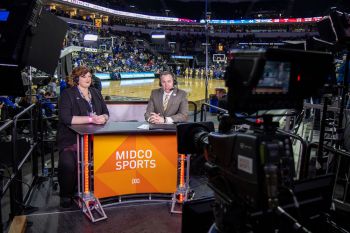 The pre- and post-game set at the Summit League gives Midco Sports a chance to interview folks that help make the tournaments possible. Here, Brian Shawn interviews Summit League Interim Commissioner Myndee Kay Larsen.