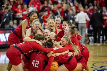 USD’s women celebrate following their championship win.