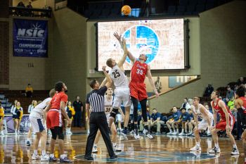 Tipoff between Augustana and MSU Moorhead during the NSIC men’s semifinals.