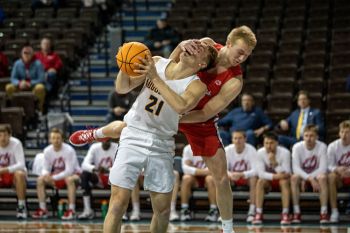 Sometimes the images I capture resemble pro wrestling more than basketball (yes, a foul was called).