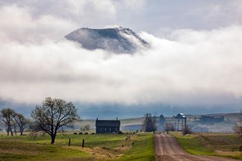 Bear Butte with a blanket of morning clouds.