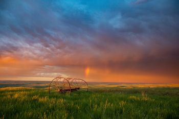 Minutes later the same hay rig with a small rainbow.