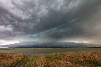 Storm clouds brewing over Bear Butte Lake.