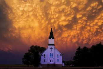 The setting sun coloring the back side of a severe storm over Immanuel Lutheran near Canova was one of the most dramatically beautiful sky scenes I have ever witnessed.