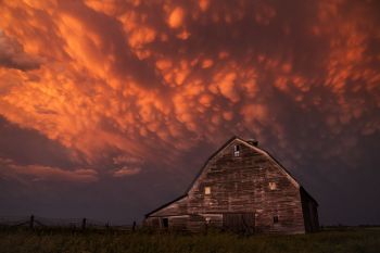 A little later the sunset colored the receding clouds nearly red.