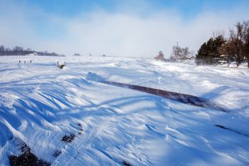 Drifting over county roads southwest of Crooks. Benton Lutheran is in the distance in the upper left.