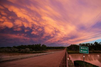 The White River as the last of the sunlight colored the clouds in shades of purple and pink.