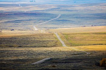 The JB Pass Road as it winds westward into the high plains beyond the Slim Buttes.