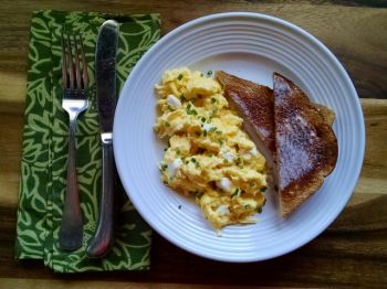 Pasques are pretty, but chives add more to these scrambled eggs.