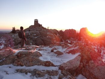 Matt Jackson watches the sun rise over Black Elk Peak on New Year's Day.