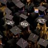 Graduates coordinated an enthusiastic message at a South Dakota State University ceremony. Photo by Greg Latza.