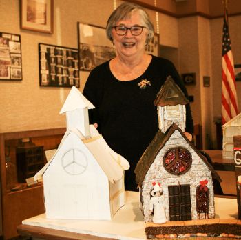 Barb Feilmeier makes a paper model before constructing her gingerbread buildings. She incorporated the very first pattern she ever made, a church, into her 2020 project, an 1880s western village.