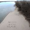 A New Year s greeting is drawn on the Missouri River beach near Yankton.