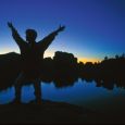 Jodi Latza enjoys the darkness atop boulders at Sylvan Lake. Photos by Greg Latza.