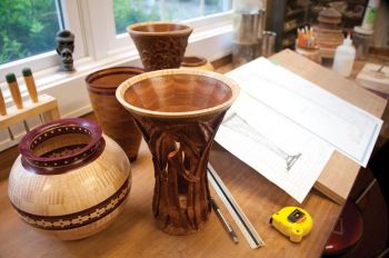 Paul Sova's wood bowls and vessels feature complex geometric designs that complement the natural beauty of the wood.