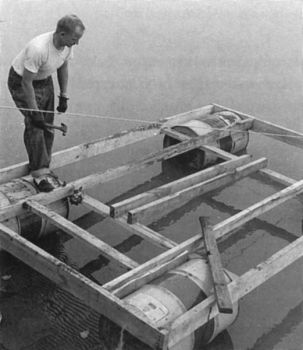 Tom Kilian constructed the raft for the trip out of a few old 30-gallon metal drums and some green cottonwood rafters.