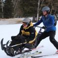 Bob Uecker, Sioux Falls, is guided by Nick Nolen, Rapid City, at Black Hills Ski for Light 2013.