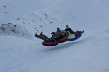 Tubers speed through a series of berms, turns and curves at the Zero Gravity Tube Park.