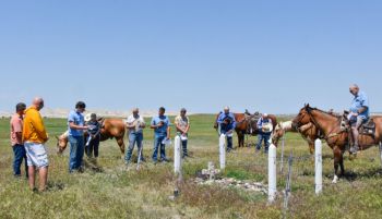 Locals and family members gathered in June for a memorial service at the gravesite of Eugene Tyree, an infant buried in the Badlands in 1916. Boy Scouts and neighborhood families have cared for the grave since the 1950s.
